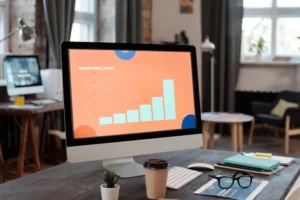 Rising advertising performance chart on desktop screen, showing results driven by a best freelance digital marketer in Dubai